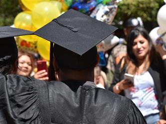 Cap and gown from behind.