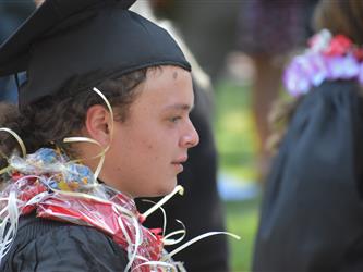 A student in graduation garb.