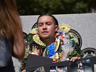 A student with a flower necklace. 